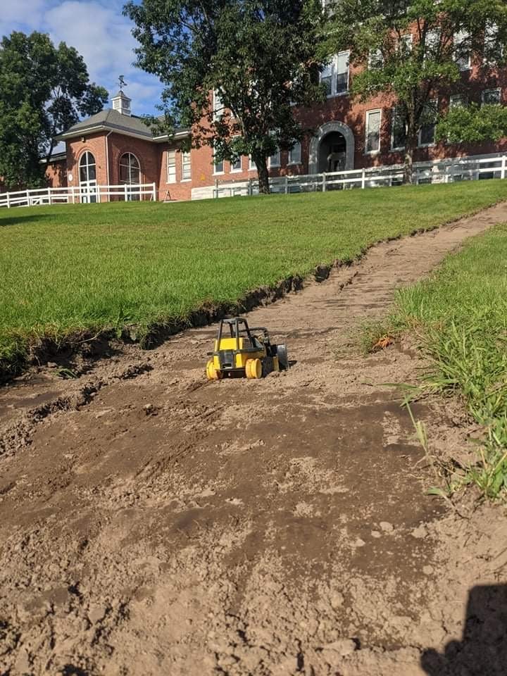 Toy Tractor in front of Lothrop School