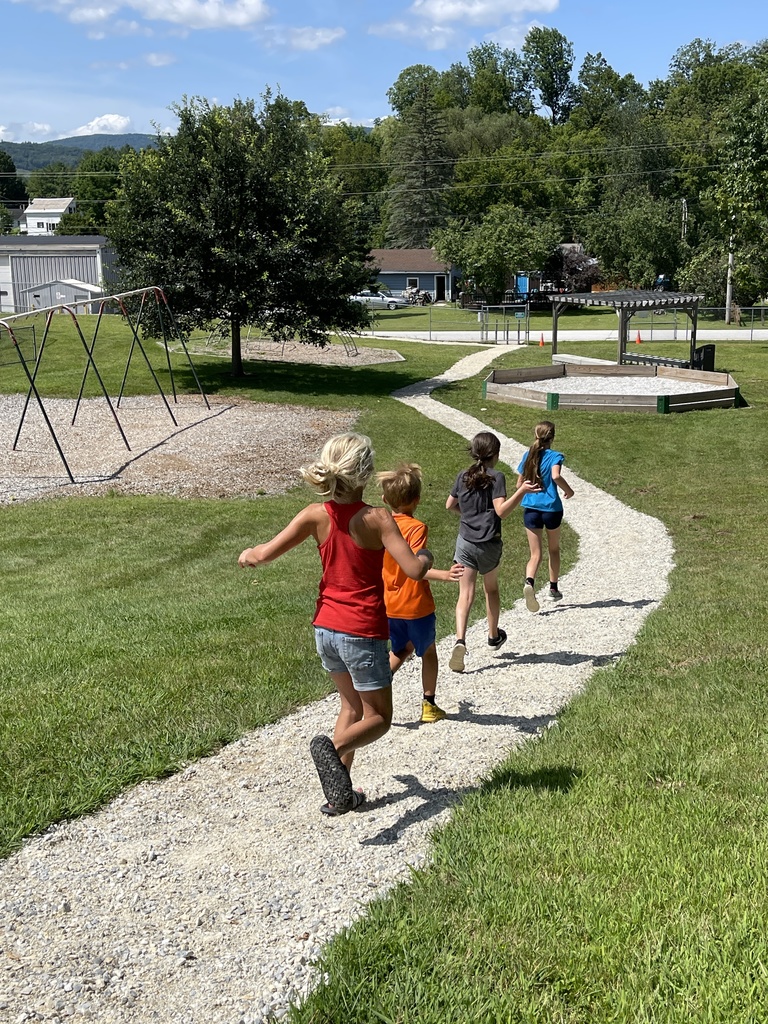 Four Children Running on a Path